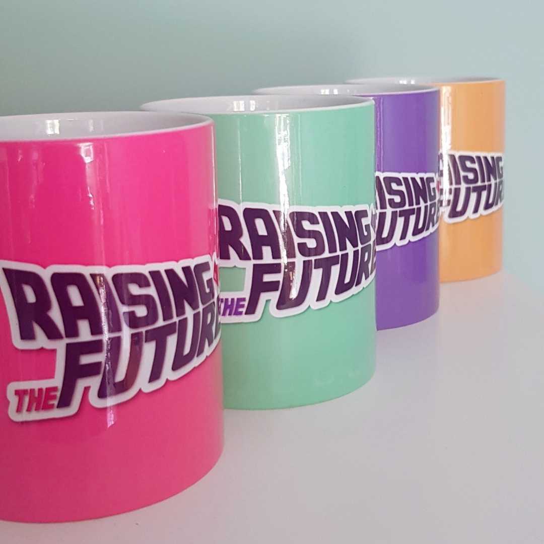 Raising The Future Mugs